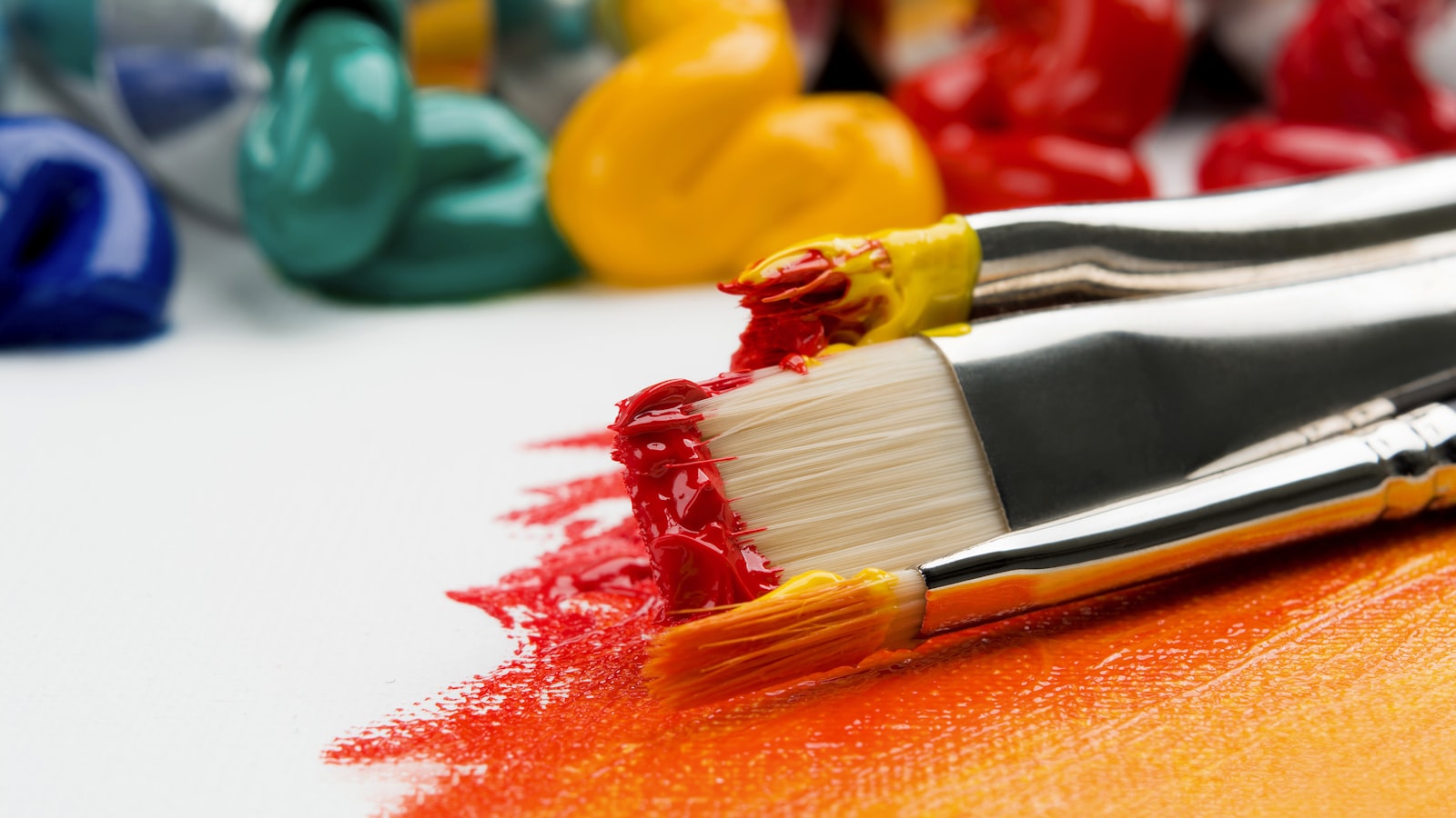 Paintbrushes of various sizes arranged together.