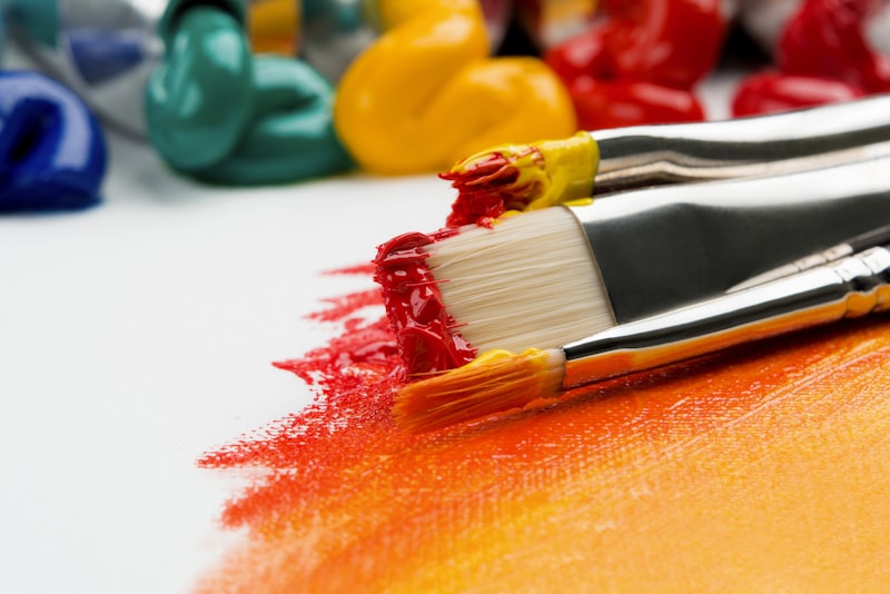 Paintbrushes of various sizes arranged together.