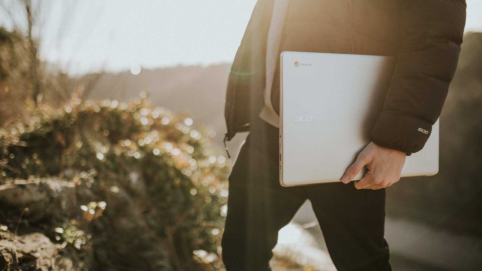A collection of colored pencils and craft materials arranged on a desk.